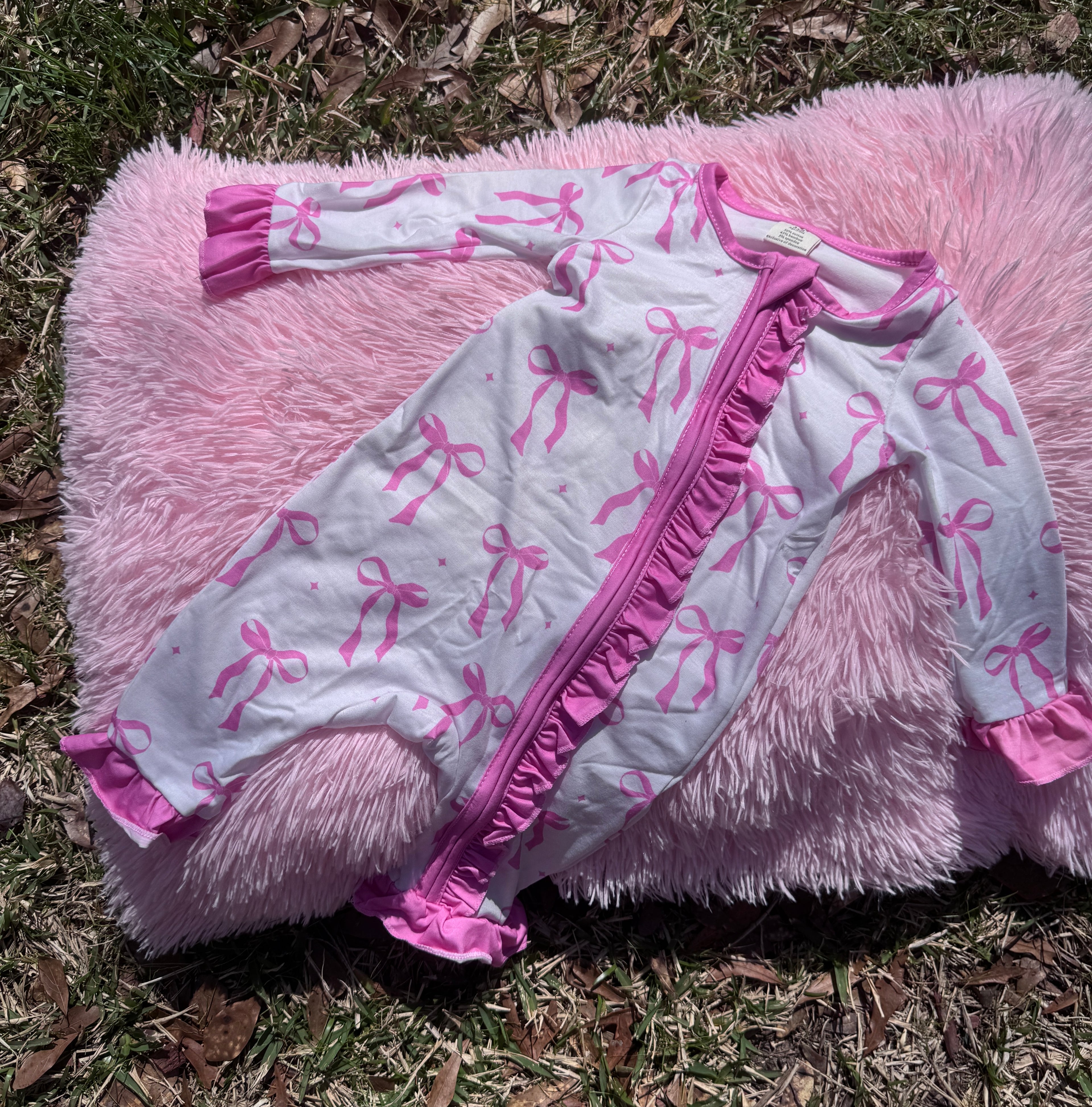 Blush Bow Ruffle Zip Romper