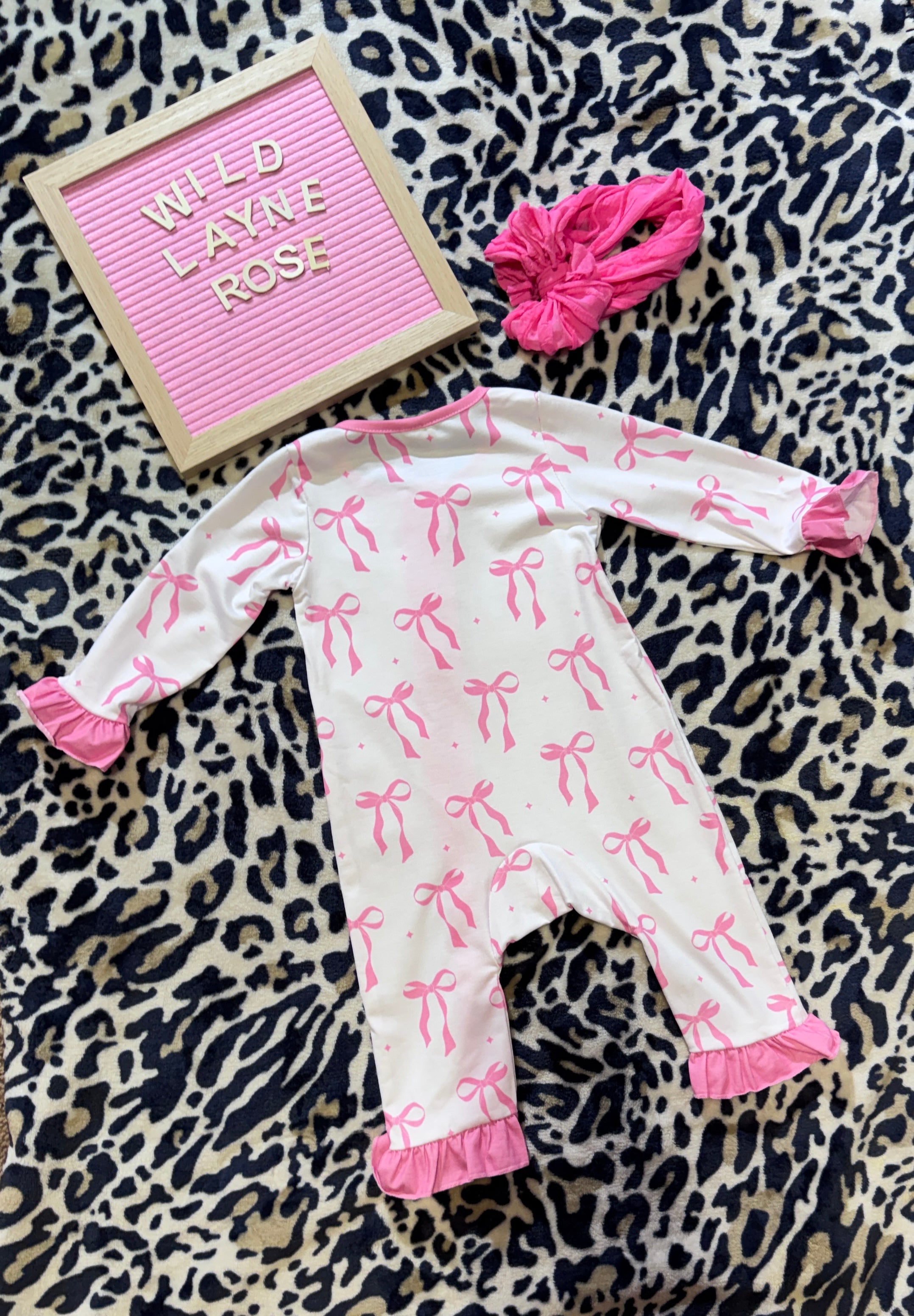 Blush Bow Ruffle Zip Romper