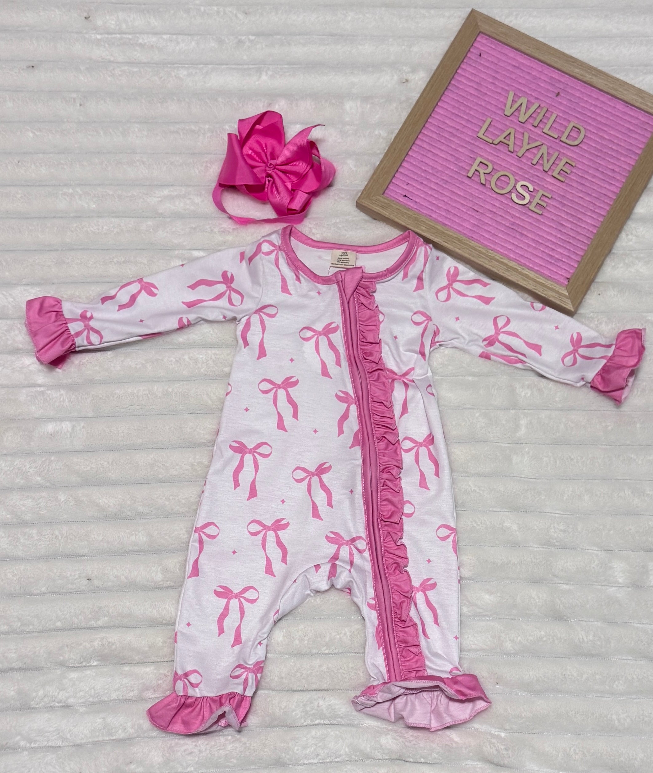 Blush Bow Ruffle Zip Romper