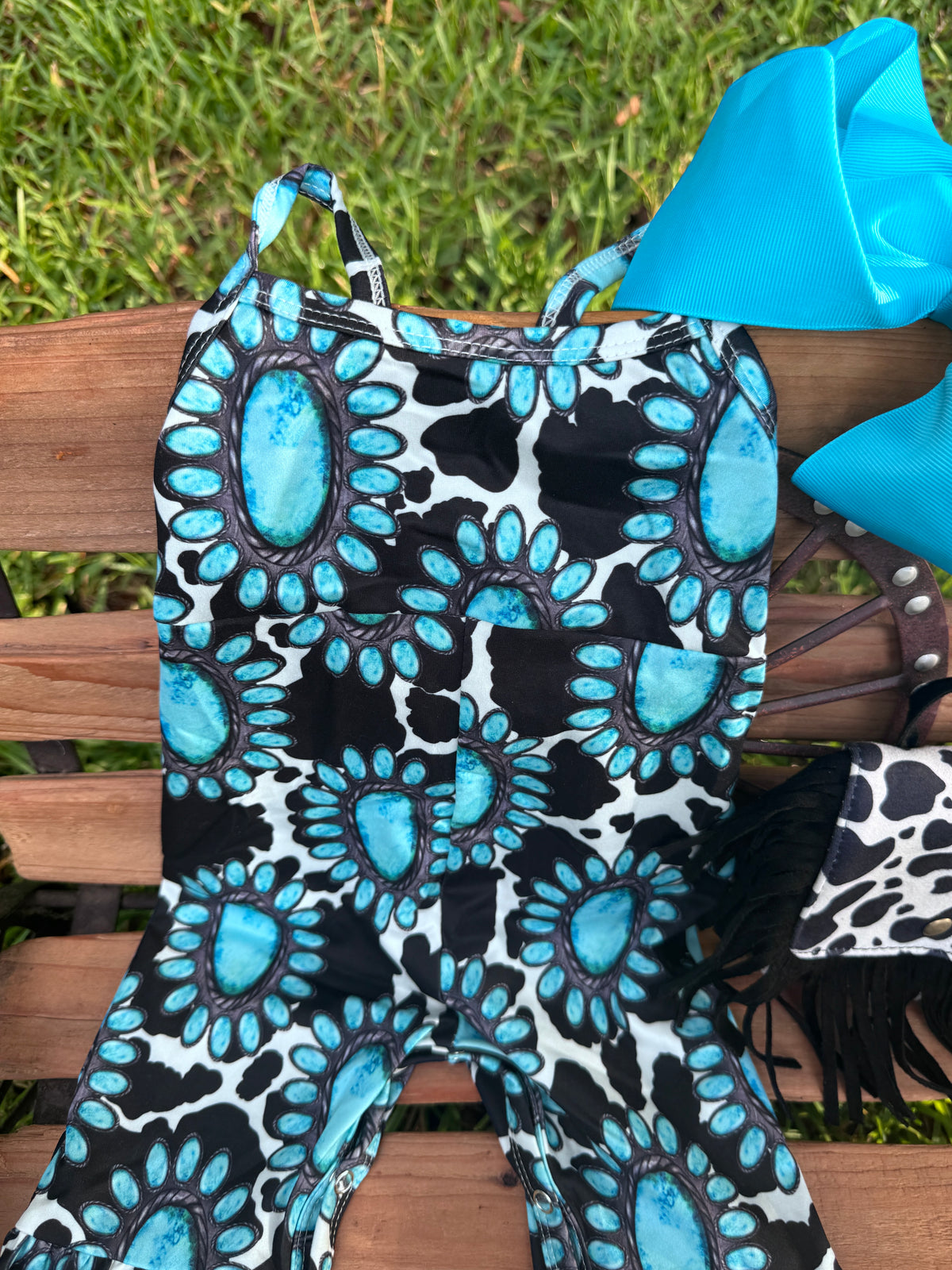 Turquoise Cow Print Bell Romper